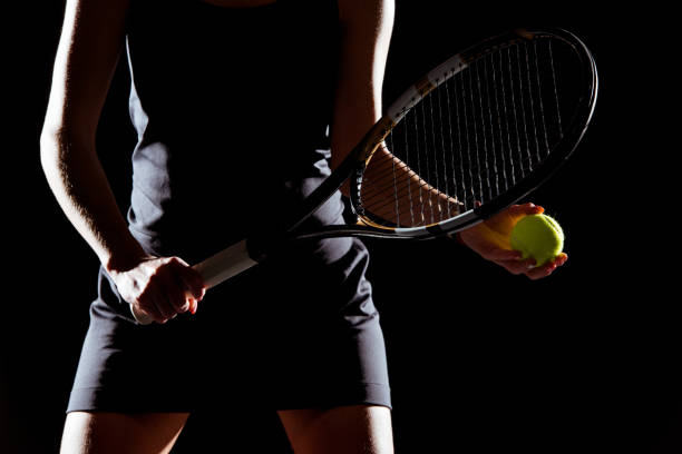 istock Woman with tennis racket and ball 659181248