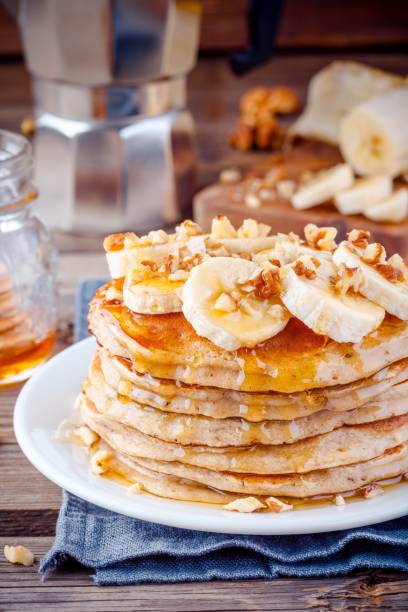 istock Oat pancakes with banana, walnuts and maple syrup 659192464