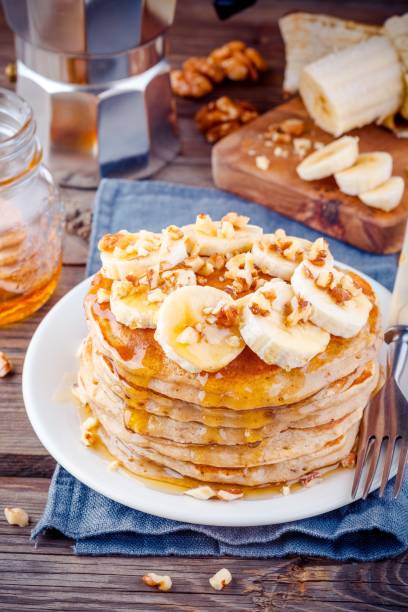 istock Oat pancakes with banana, walnuts and honey 659193044