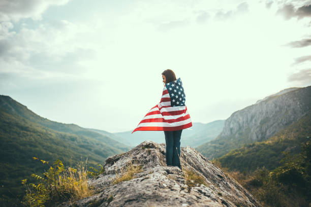 istock Woman wrapped in US flag 659201928