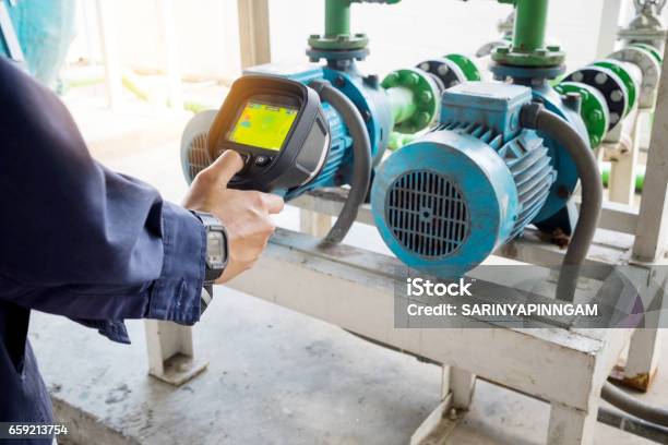 Technician Use Thermal Imaging Camera To Check Temperature In Factory Stock Photo - Download Image Now