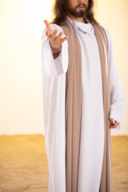istock Silhouette of Messiah reaching hand 659221010