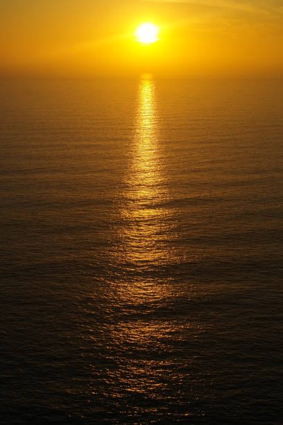 istock Sunset sky sea sunbeam ocean reflection waves swells yellow 659223032