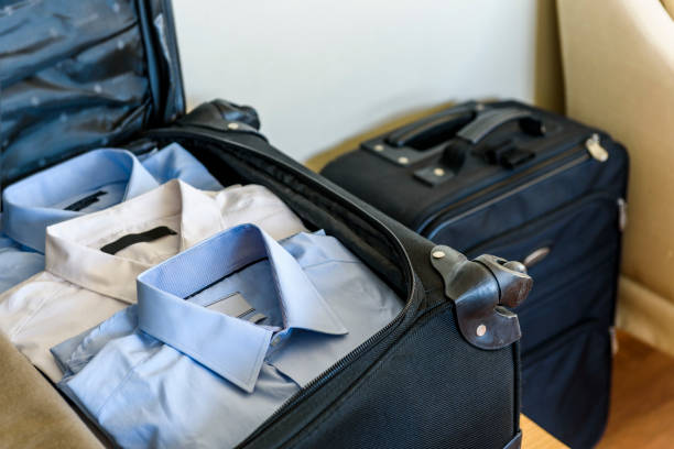 istock Folded clothes in travel suitcase inside a hotel room 659227072