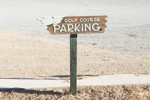 wooden Golf course parking sign