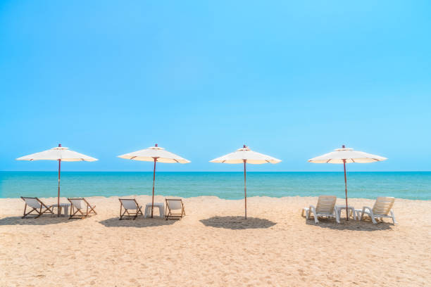 istock Beach chairs with umbrella with blue sky on tropical beach. 659274822