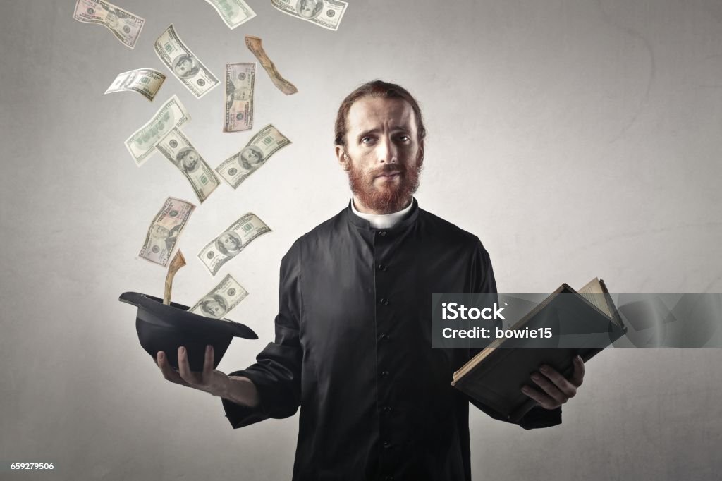 Priest gets some money Priest with a book in his hand, and in the other hand is a hat and that is full of money Preacher Stock Photo