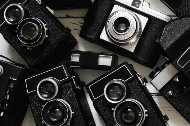 istock collection old vintage retro photo cameras on  wooden background. top view, medium format 659284112