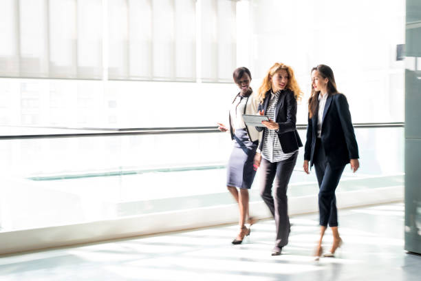 istock Business women walking in a hall 659285522