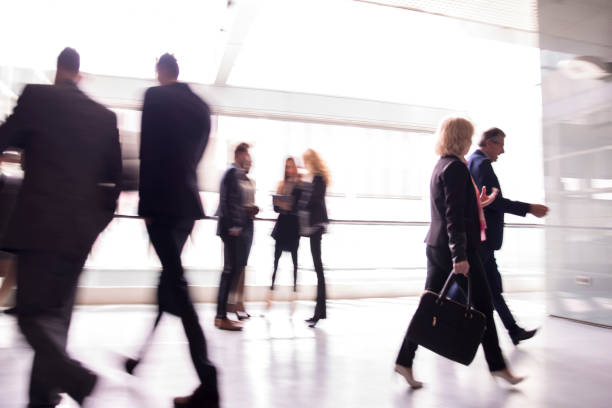 istock Business people walking down the hall 659297072