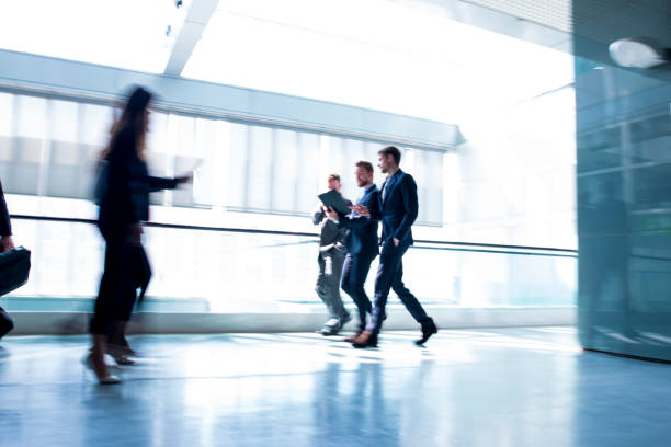 istock Business people walking down the hall 659298096