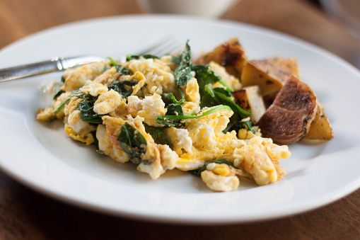 Scrambled eggs with baby organic spinach.  Roasted potatoes.