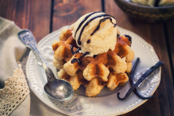 Homemade sweet Belgian waffles with vanilla ice cream