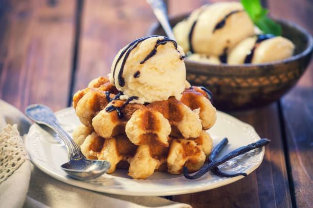 Homemade sweet Belgian waffles with vanilla ice cream