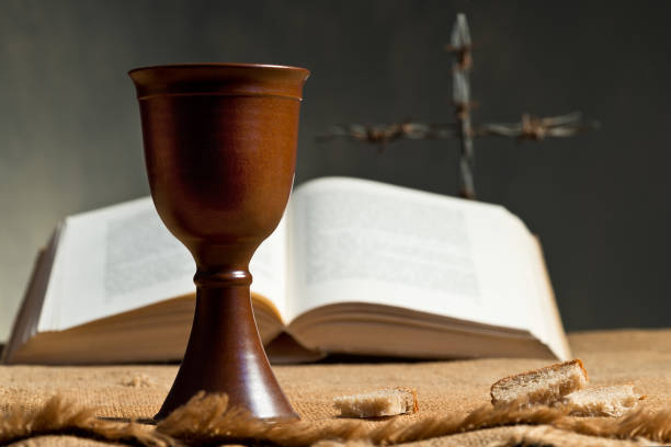 istock Chalice Of Wine With Bread And Bible 659333086