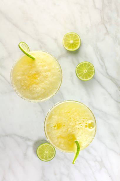 istock Lemon Margarita cocktails with limes and copy space 659336372