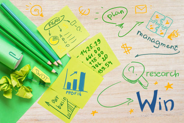 istock Wooden desktop with business drawings 659352626