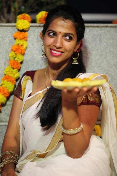 istock Indian Woman Holding Sweets 659362466