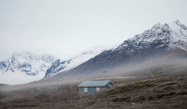 A small cabin located in the mountainous suburbs of Iceland.