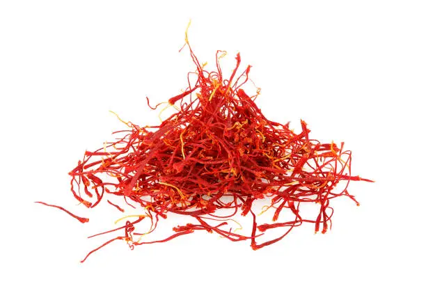 heap of saffron threads isolated on white