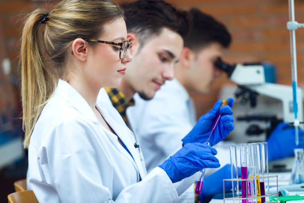 istock Young scientists carrying out an experiment in a laboratory. 659425666
