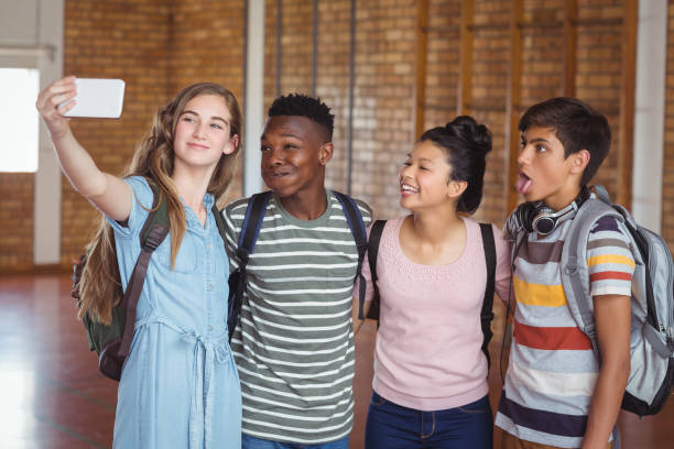 istock Happy students taking selfie on mobile phone in campus 659435020