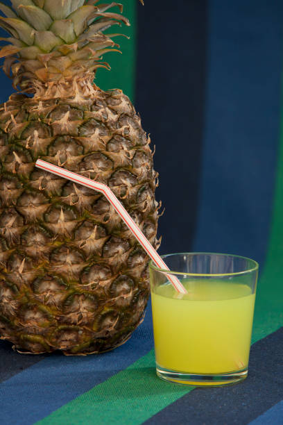 istock Pineapple juice and straws still life 659446546