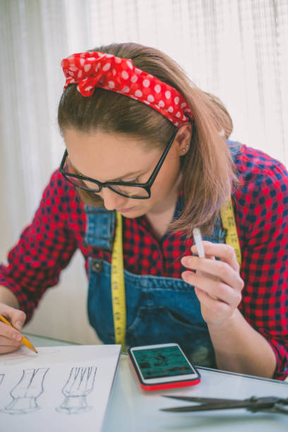 istock seamstress drawing templates in tracing paper 659447404