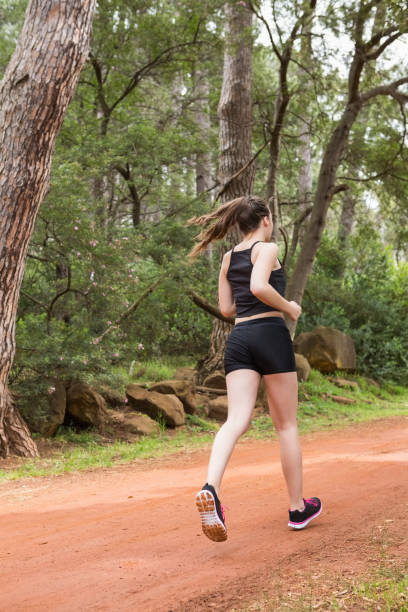 istock Fit healthy woman jogging 659448174