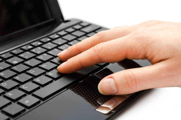 istock hand of girl typing on keyboard. 659449024