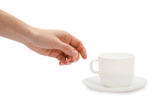 istock woman hand holding white cup. 659460036