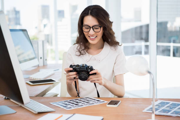 istock A woman is watching photos 659468012