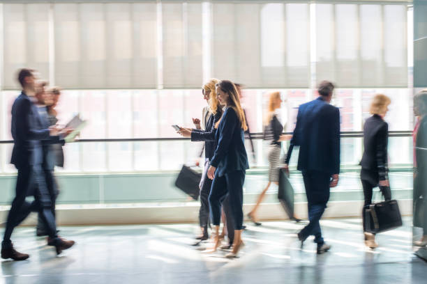 istock People in business center lobby 659468122