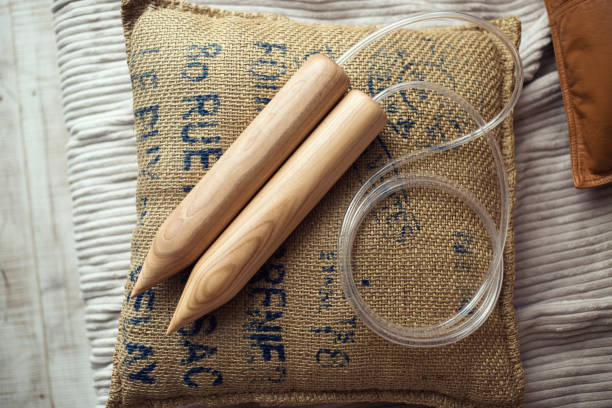 istock wooden knitting needles on pillow in a grunge style 659471210