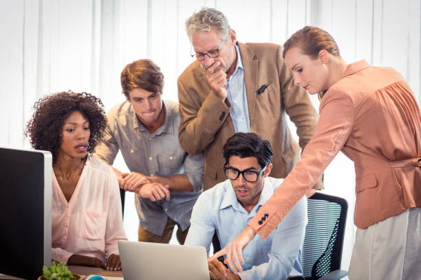 istock Business people discussing over laptop 659495166