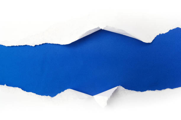 torn white paper on blue background. Cocept for autism awareness day. Break barriers together for autism torn white paper on blue background. Cocept for autism awareness day. curled up photos stock pictures, royalty-free photos & images