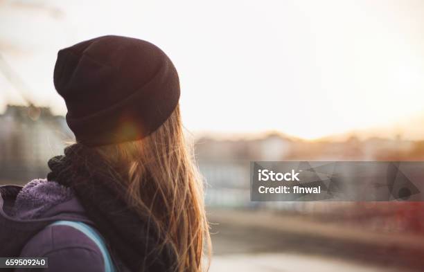 Hipster Girl Looking At Sunset Stock Photo - Download Image Now - Rear View, Teenager, Sadness