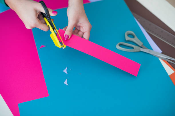 istock Woman make scrapbook of the papers on the table 659524078