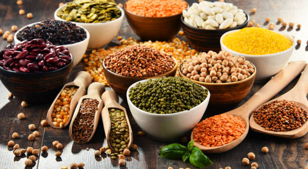 Composition with variety of vegetarian food ingredients Composition with variety of vegetarian food ingredients. bean stock pictures, royalty-free photos & images