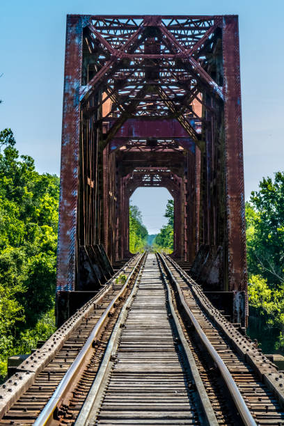 istock Old Railroad Trestle with an Old Iconic Iron Truss Bridge 659525574