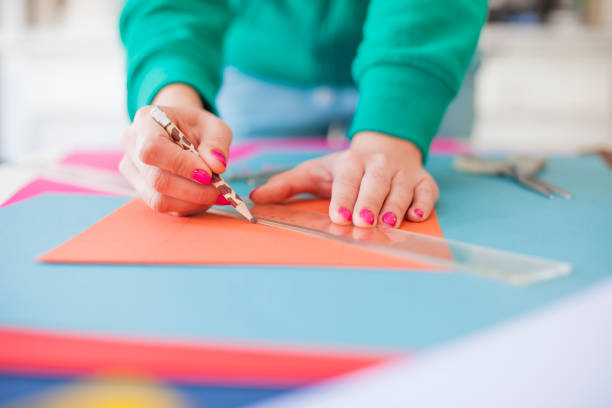 istock Woman make scrapbook of the papers on the table 659526080
