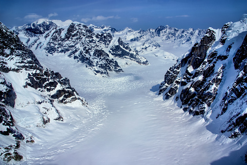 Aerial View of the Headwaters of a Beautiful Glacier in the Great Alaskan Wilderness, Denali National Park, Alaska.  A Beautiful Snowscape of Rock, Snow, and Ice.
