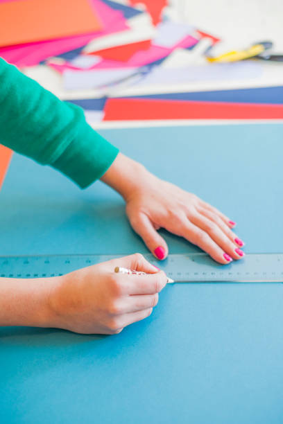 istock Woman make scrapbook of the papers on the table 659531364