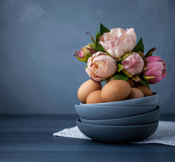 istock Organic fresh brown eggs with peony bouquet 659541160