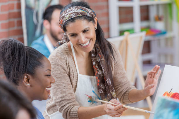 istock Confident artist teaches in an art studio 659542606