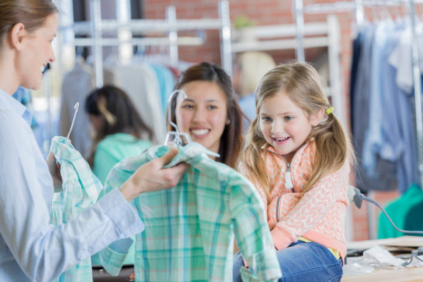 istock Cute little girl shops with her mom 659543210