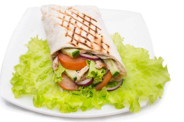 istock Shawarmas on lettuce isolated a white background 659547908