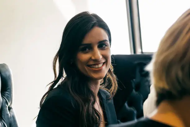Woman smiling in a business meeting