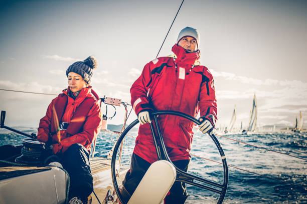 istock Sailing crew on sailboat on regatta on sunny autumn morning 659549496