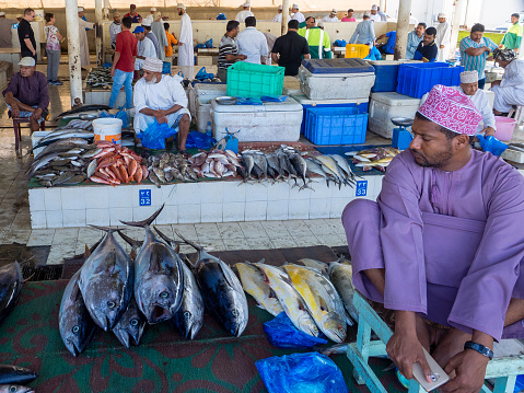 Muscat, Oman, 12 March 2017: fish market at Muttrah, town center of Muscat, Oman. Several tuna and other fish on stalls.